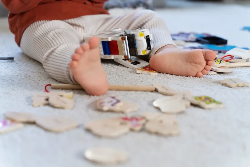close-up-kid-with-car-wooden-toys