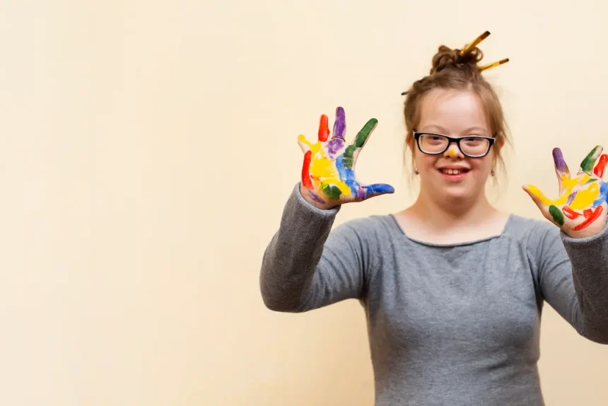 girl-with-down-syndrome-showing-off-colorful-palms