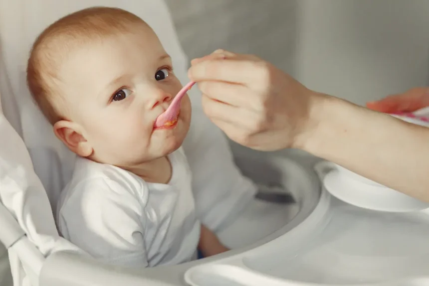 mother-feeding-her-little-baby-kitchen